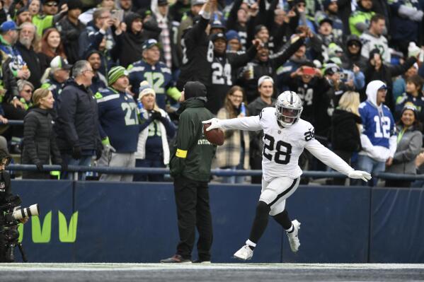Jacobs caps huge day with TD in OT Raiders beat Seahawks AP News